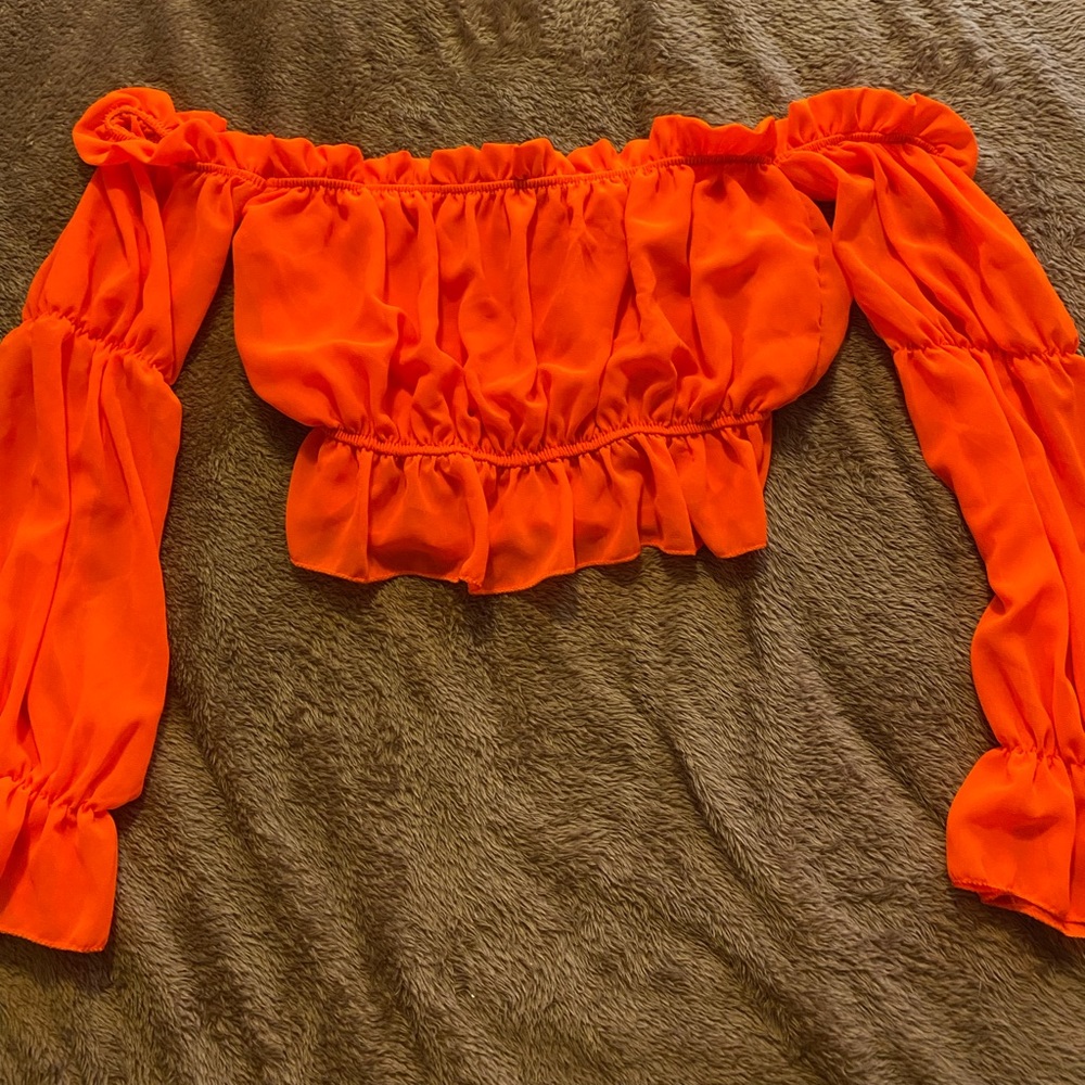 Orange long sleeve off the shoulder shirt, never worn.